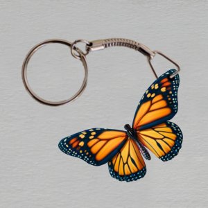 Zahrada Flora - oranžový motýl- klíčenka